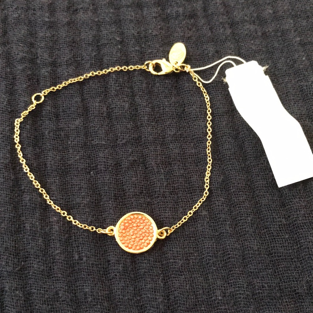NWT Charming Charlie gold bracelet with coral pink circle center